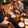 lifestyle image of people talking and eating in an outdoor environment